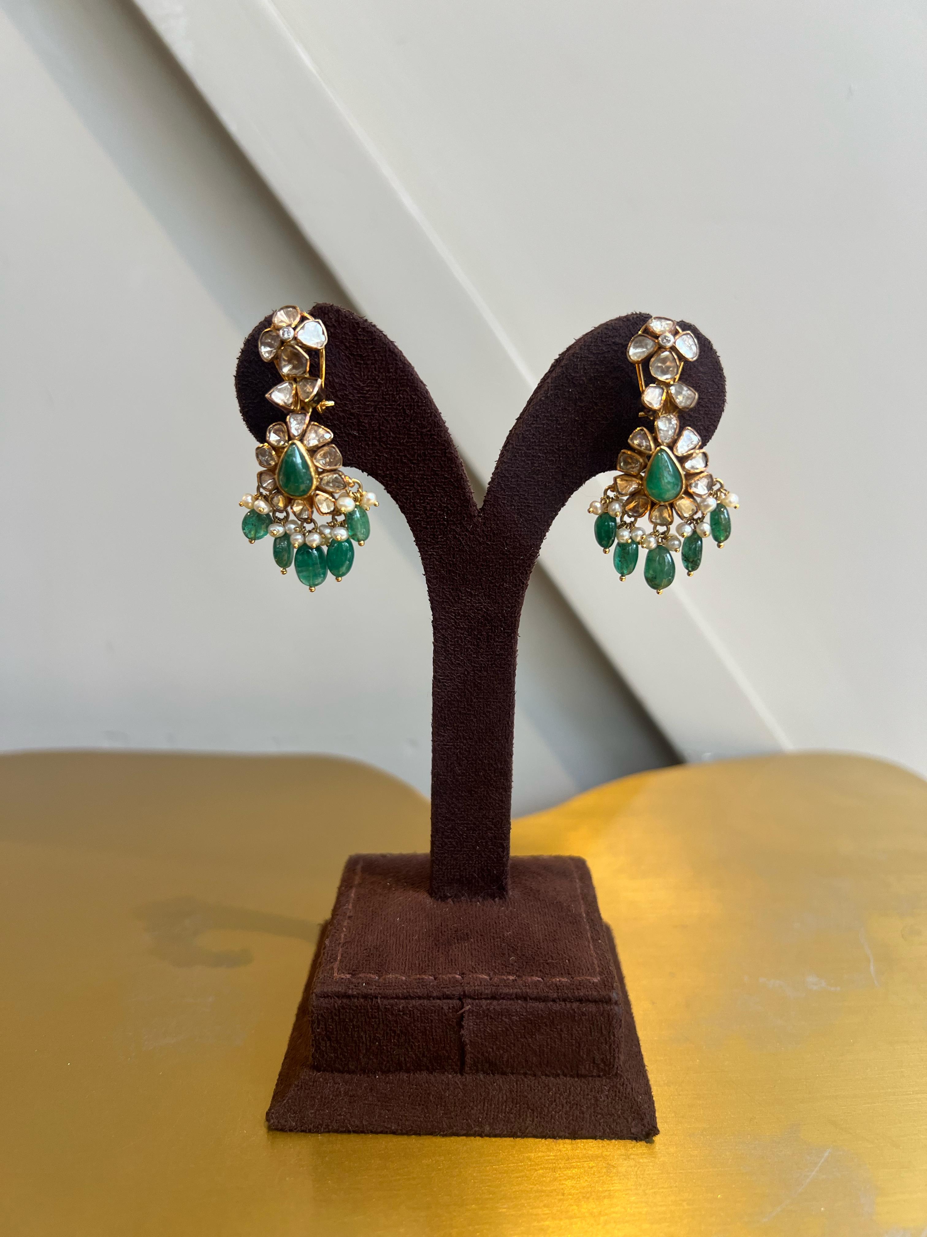 Polki earrings studded with Emerald